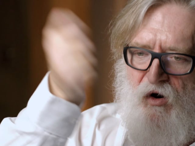 Gabe Newell demonstrates smacking a crowbar into a wall