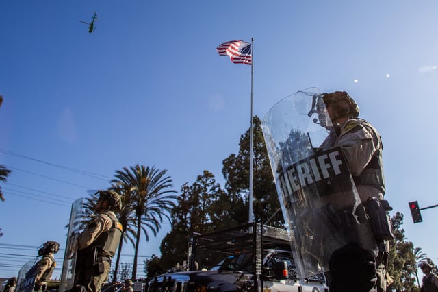 Los Angeles Sheriff Department officers arrive to help after the U.S. Border Patrol and protesters clash after a raid was conducted by Immigration and Customs Enforcement near a Home Depot on June 7, 2025 in Paramount, California.