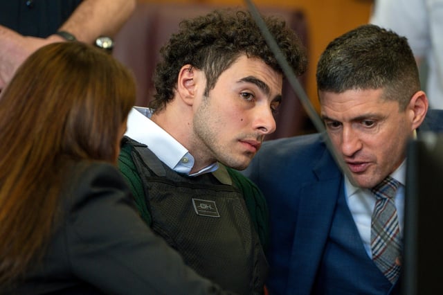 Attorney Karen Friedman Agnifilo (L) and Luigi Mangione attend a hearing at Manhattan Criminal Court on February 21, 2025 in New York City. Mangione is accused of slaying of UnitedHealthcare CEO Brian Thompson late last year and is making his first appearance on state charges of murder as an act of terrorism. He is facing 11 counts for the Dec. 4 shooting of Thompson outside a midtown Manhattan hotel which set off a massive manhunt. He is also facing federal charges of murder and other charges in Pennsylvania, where he was arrested.