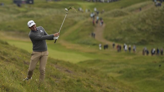 Keegan Bradley plays from the rough on the 7th hole during the second round of the British Open on Friday. (AP)