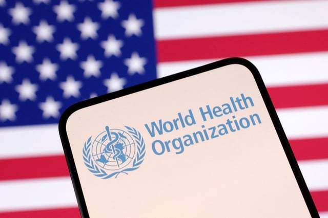 World Health Organization (WHO) logo and U.S. flag are seen in this illustration taken April 23, 2025. REUTERS/Dado Ruvic/Illustration