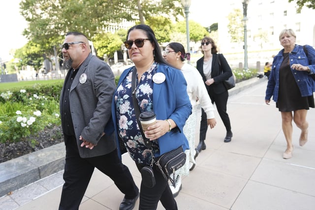 Javier Cazares, left, and Gloria Cazares arrive for a court hearing in a lawsuit between victims' families in the 2022 Uvalde, Texas school shooting and Meta Platforms on Friday, July 18, 2025, in Los Angeles. (AP Photo/Eric Thayer)