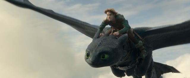 (from left) Night Fury dragon, Toothless, and Hiccup (Mason Thames) in Universal Pictures’ live-action How to Train Your Dragon, written and directed by Dean DeBlois.