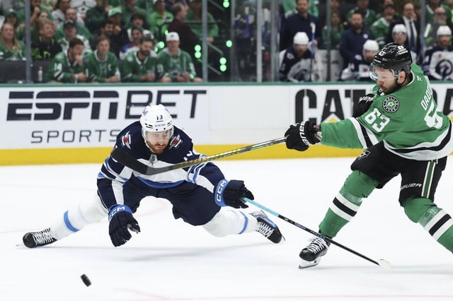 Winnipeg Jets centre Gabriel Vilardi (13) blocks a shot by Dallas Stars' Evgenii Dadonov (63) in the first period of Game 6 of a second-round NHL hockey playoff series in Dallas, Saturday, May 17, 2025. (AP Photo/Gareth Patterson)