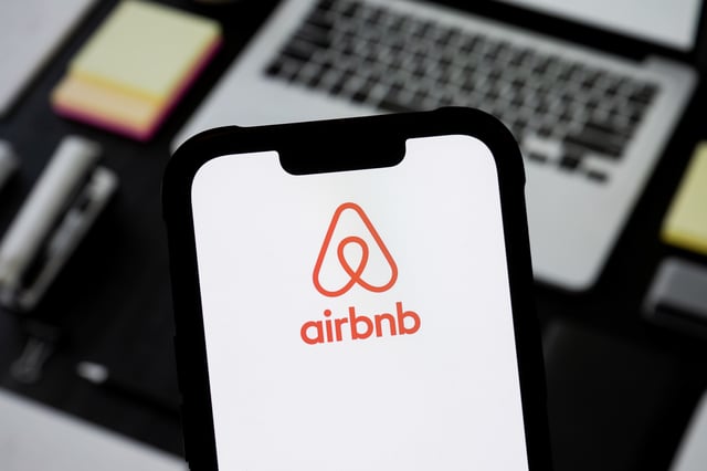 POLAND – 2025/03/02: In this photo illustration, an Airbnb logo seen displayed on a smartphone. (Photo Illustration by Mateusz Slodkowski/SOPA Images/LightRocket via Getty Images)