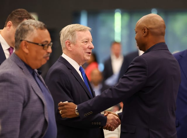 U.S. Sen. Dick Durbin shakes hands with Illinois House Speaker Emanuel &#34;Chris&#34; Welch at the  Cook County Democratic Party primary slating at the IBEW Local 134 meeting hall on July 18, 2025, in Chicago. The party failed to endorse a candidate for the retiring Durbin’s seat. (Stacey Wescott/Chicago Tribune)