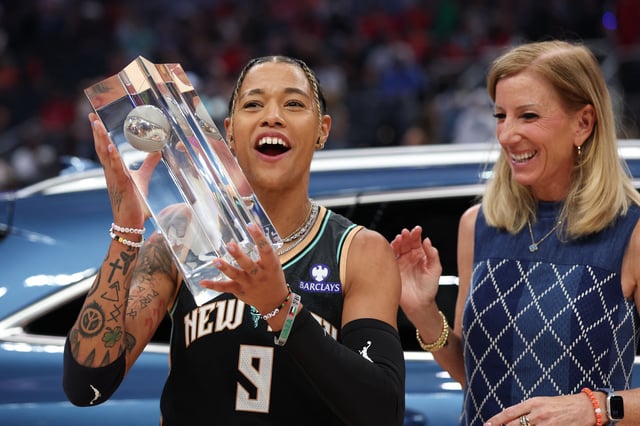 Jul 18, 2025; Indianapolis, IN, USA; New York Liberty guard Natasha Cloud receives her trophy from WNBA commissioner Cathy Engelbert during the 2025 WNBA All Star Skills Challenge at Gainbridge Fieldhouse. Trevor Ruszkowski-Imagn Images