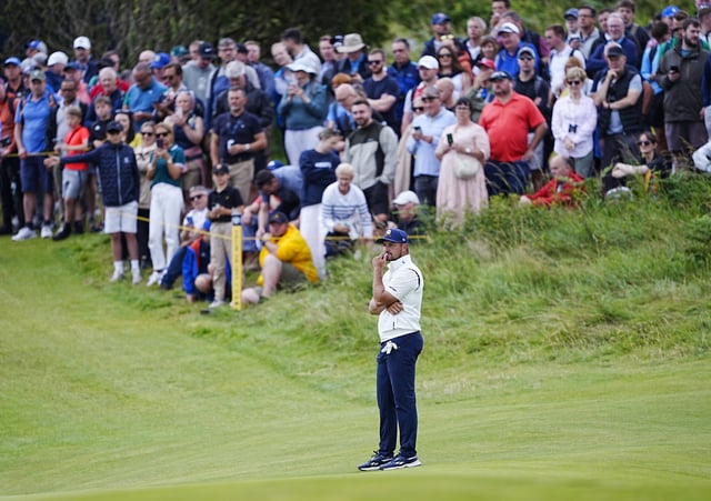 DeChambeau considers his options on the green at the 2nd