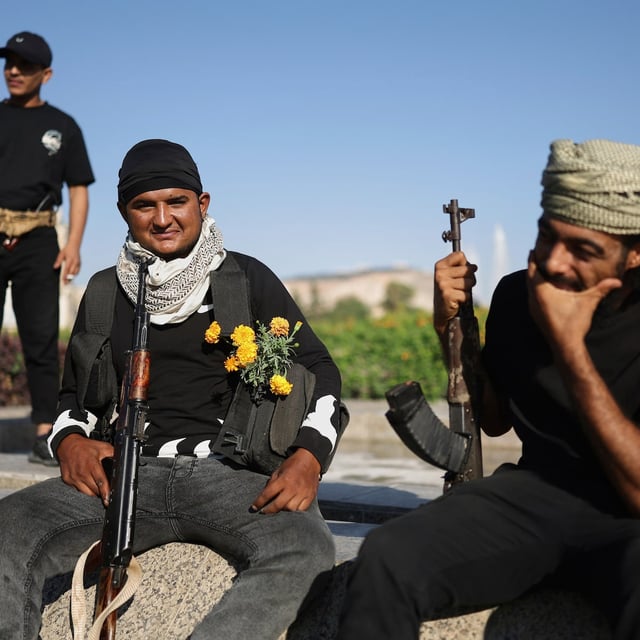 Bedouin fighters from various provinces gather at Umayyad Square in Damascus, Syria, Saturday, July 19, 2025, before heading to the southern province of Sweida to join clashes between Bedouin clans and Druze militias. (AP Photo/Ghaith Alsayed)
