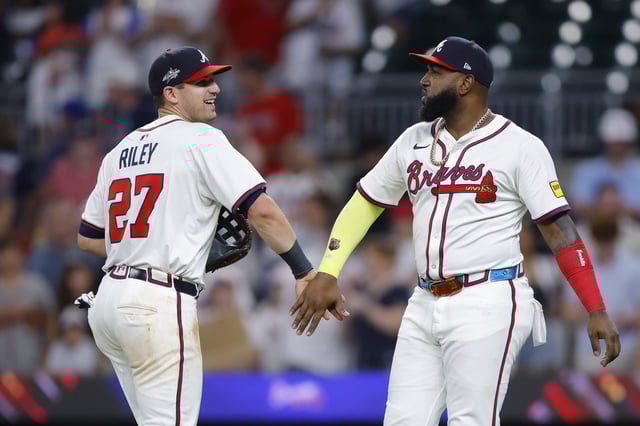 ATLANTA, GEORGIA - JULY 2: Austin Riley #27 and Marcell Ozuna #20 of the Atlanta Braves celebrate following the 8-3 victory over the Los Angeles Angels at Truist Park on July 2, 2025 in Atlanta, Georgia.