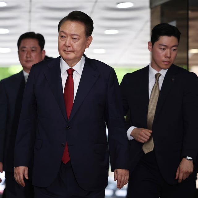 Former South Korean President Yoon Suk Yeol, centerm arrives at a court to attend a hearing to review his arrest warrant requested by special prosecutors in Seoul, South Korea Wednesday, July 9, 2025. (Kim Hong-Ji/Pool Photo via AP)