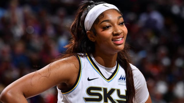 Angel Reese of the Chicago Sky smiles during their game against the Phoenix Mercury..