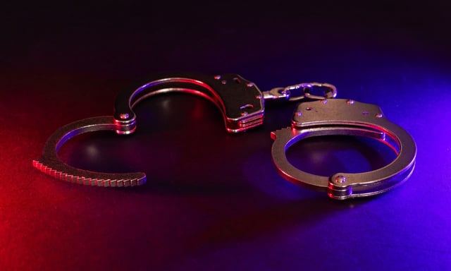 handcuffs police arrest stock shutterstock