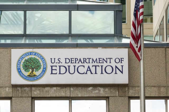 WASHINGTON, DC - MAY 18: A Department of Education sign is displayed outside of their federal student aid office on May 18, 2025 in Washington, DC. (Photo by Kevin Carter/Getty Images)