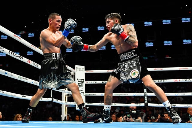 Juan Francisco Estrada (L) of Mexico and Jesse ‘Bam’ Rodriguez (R) of the United States fight during their WBC world and Ring Magazine super flyweight title bout at Footprint Center on June 29, 2024 in Phoenix, Arizona.