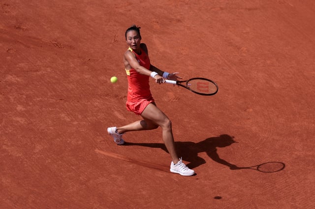 Paris 2024 Olympics - Tennis - Women's Singles Quarterfinals - Roland-Garros Stadium, Paris, France - July 31, 2024. Qinwen Zheng of China in action during her match against Angelique Kerber of Germany. REUTERS/Claudia Greco/File Photo