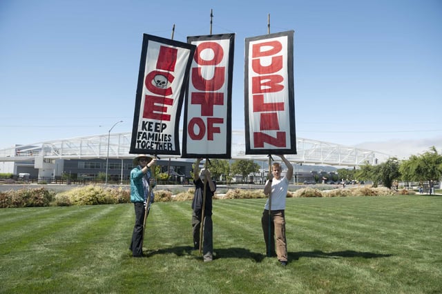 Matthew Bridges, David Solnit and Leo Colletta protest the prospect of new immigrant detention centers in Northern California.