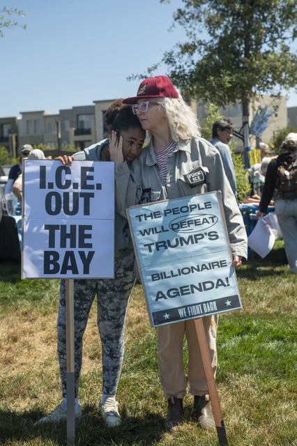Kathy Batt and her daughter Odessa protest near the former federal prison in Dublin.