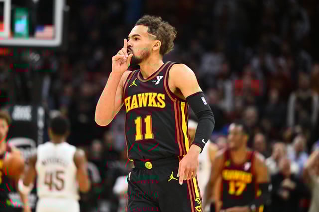 Trae Young #11 of the Atlanta Hawks silences the crowd during the fourth quarter against the Cleveland Cavaliers at Rocket Mortgage Fieldhouse on November 27, 2024 in Cleveland, Ohio.