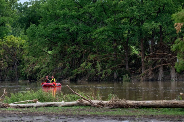 Search and rescue operations are performed in the Guadalupe River in Kerrville, Texas, on July 14.
