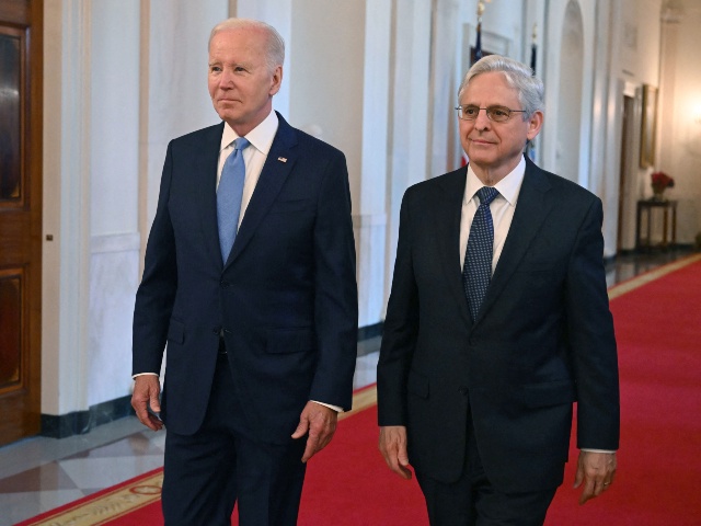 US President Joe Biden (L) and Attorney General Merrick Garland arrive for a ceremony to honor the 2021-2022 Medal of Valor recipients in the East Room of the White House in Washington, DC, on May 17, 2023. (SAUL LOEB/AFP via Getty)