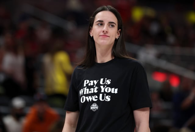 Caitlin Clark #22 of the Indiana Fever wears a shirt saying &#34;Pay us what you owe us&#34; prior to the 2025 AT&amp;T WNBA All-Star Game at Gainbridge Fieldhouse on July 19, 2025 in Indianapolis, Indiana.