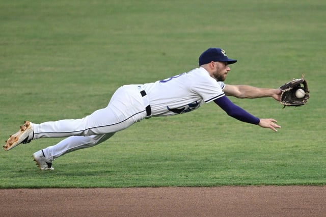 Rays second baseman Brandon Lowe (8) dives to catch a grounder by  Baltimore&#39;s Jackson Holliday before completing the throw to first base for the out during the fifth inning on Saturday in Tampa.  (AP Photo/Phelan M. Ebenhack)