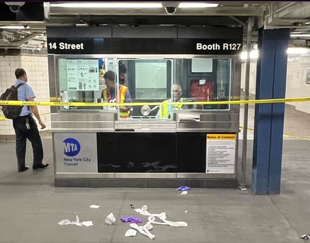 After the knife fight at the W. 14th St.-Seventh Ave. subway station Saturday night, the token booth was cordoned off behind police tape, with a pile of medical gloves and surgical towels in front of it. (Julian Roberts-Grmela for New York Daily News)