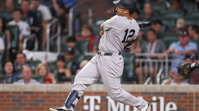Jul 19, 2025; Atlanta, Georgia, USA; New York Yankees center fielder Trent Grisham (12) drives in a run on a fielder’s choice against the Atlanta Braves in the sixth inning at Truist Park. Mandatory Credit: Brett Davis-Imagn Images