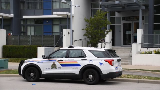 A RCMP vehicle seen parked outside the scene of a homicide in Richmond on Friday, July 18, 2025.