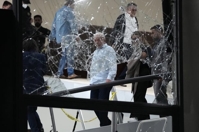 FILE - Brazil's President Luiz Inacio Lula da Silva surveys the damage at the Planalto Palace after it was stormed by supporters of former President Jair Bolsonaro, in Brasilia, Brazil, Jan. 8, 2023. (AP Photo/Eraldo Peres, File)
