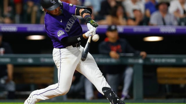 Hunter Goodman of the Colorado Rockies hits a two-run home run in the eighth inning against the Minnesota Twins at Coors Field on Saturday, July 19, 2025, in Denver. (Justin Edmonds/Getty Images/TNS)