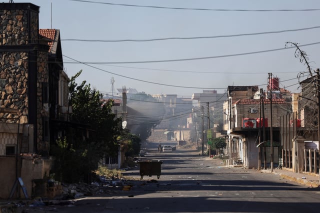 A view shows a street in the village of Walgha, near an Internal Security Forces checkpoint working to prevent Bedouin fighters from advancing towards Sweida, following renewed fighting between Bedouin fighters and Druze gunmen, despite an announced truce, in Sweida province, Syria July 19, 2025. REUTERS/Khalil Ashawi/File Photo