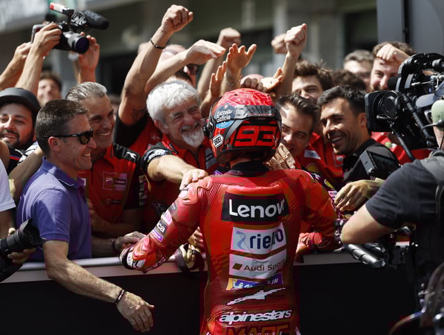 MotoGP - Czech Republic Grand Prix - Masaryk Circuit, Brno, Czech Republic - July 20, 2025 Ducati Lenovo Team's Marc Marquez celebrates with his team after winning the MotoGP race REUTERS/David W Cerny