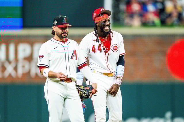 ATLANTA, GA - JULY 15: Eugenio Suárez #54 of the Arizona Diamondbacks and Elly De La Cruz #44 of the Cincinnati Reds laugh during the MLB All-Star Game at Truist Park on July 15, 2025 in Atlanta, Georgia.