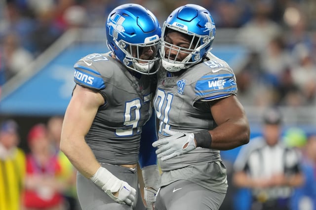 Aidan Hutchinson #97 of the Detroit Lions celebrates after a sack with Levi Onwuzurike #91 during the third quarter in the game against the Minnesota Vikings at Ford Field on January 07, 2024 in Detroit, Michigan.