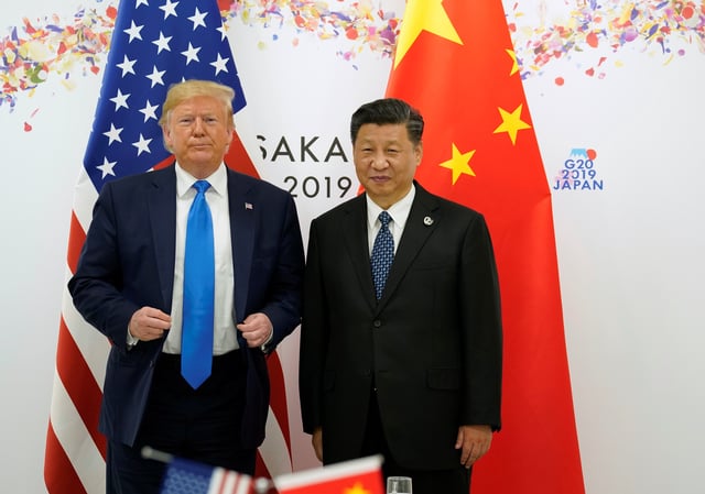 U.S. President Donald Trump and China's President Xi Jinping pose for a photo ahead of their bilateral meeting during the G20 leaders summit in Osaka, Japan, June 29, 2019. REUTERS/Kevin Lamarque/File Photo