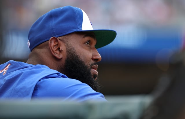 ATLANTA, GEORGIA - JULY 19: Marcell Ozuna #20 of the Atlanta Braves looks on from the dugout in the first inning against the New York Yankees at Truist Park on July 19, 2025 in Atlanta, Georgia.