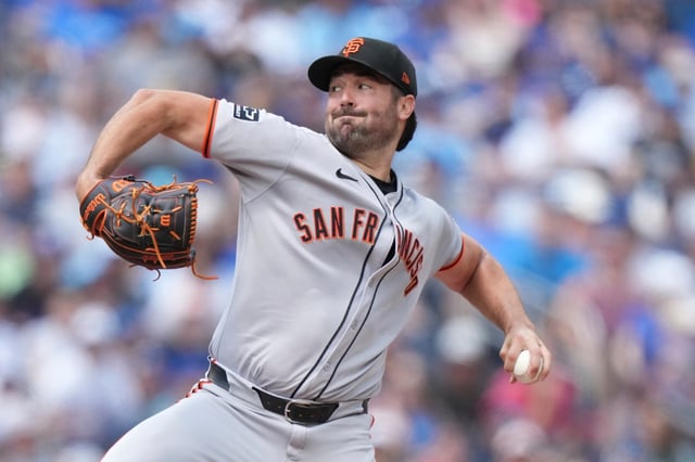 San Francisco Giants pitcher Robbie Ray (38) throws during the first inning of a baseball game against the Toronto Blue Jays in Toronto on Sunday, July 20, 2025. (Nathan Denette/The Canadian Press via AP)