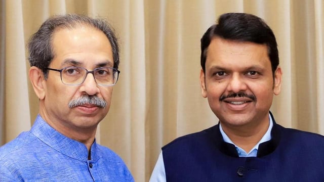 Shiv Sena (UBT) Chief Uddhav Thackeray presents the book 'Why Do You Want Hindi?' compiled by various editors across the state against the compulsory implementation of Hindi, to state Chief Minister Devendra Fadnavis, at Vidhan Bhavan in Mumbai on Thursday. 