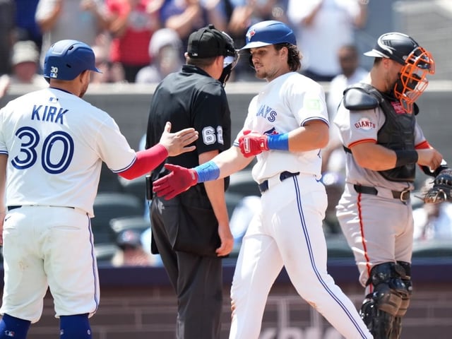Toronto Blue Jays third base Addison Barger celebrates his two run home run with teammate catcher Alejandro Kirk (30) during fifth inning MLB action against the San Francisco Giants in Toronto on Sunday, July 20, 2025.