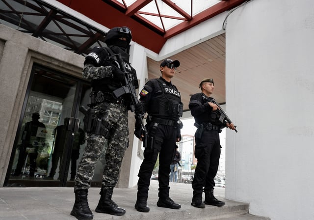Security forces stand outside the National Court of Justice following a hearing for the extradition of Ecuadorean gang leader Jose Adolfo Macias, known as "Fito," who on Friday accepted the court's request to be extradited to the United States to face drug and gun charges, in Quito, Ecuador, July 11, 2025. REUTERS/Karen Toro/File Photo