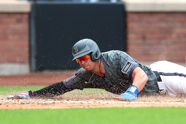 NEW YORK, NEW YORK - JULY 20: Tyrone Taylor #15 of the New York Mets slides into home plate to score during the third inning against the Cincinnati Reds at Citi Field on July 20, 2025 in the Queens borough of New York City. (Photo by Ishika Samant/Getty Images)