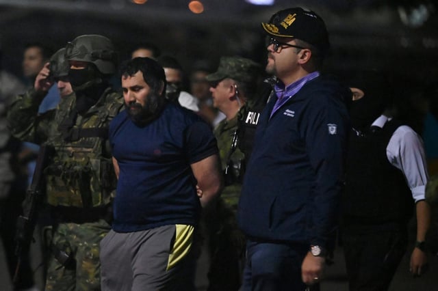 Drug trafficker Adolfo Macias (C), alias Fito, was taken to an air base in Guayaquil, Ecuador, on June 25, 2025, after his recapture in Manta, Manabi Province