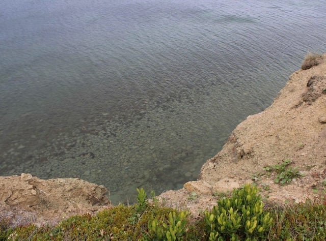  The edge of a cliff in a field area close to the top end of Convent Street in New Waterford. Emergency personnel — including the regional police service’s dive unit, a regional fire rescue and EHS — attended the scene from the waterside to discover the body of a young boy on Saturday near a shoreline area close to New Waterford.