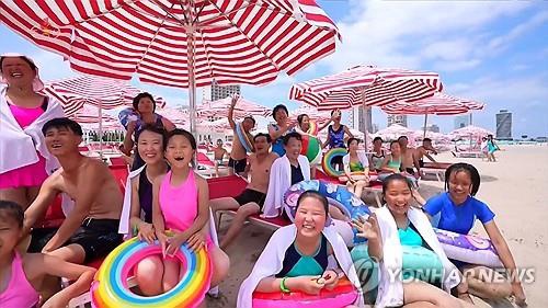This image of tourists at the Kalma coastal tourist zone in Wonsan was captured from the Korean Central Television on July 16, 2025. (For Use Only in the Republic of Korea. No Redistribution)