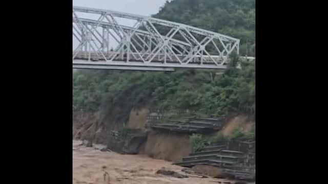 A screen grab of the train passing over the railway bridge when a portion of the retaining wall collapsed near Dhangu in Kangra district of Himachal Pradesh on Monday.