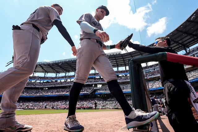 New York Yankees outfielder Aaron Judge (99) walks to the dugout in the fifth inning of a baseball game against the Atlanta Braves, Sunday, July 20, 2025, in Atlanta. (AP Photo/Mike Stewart)