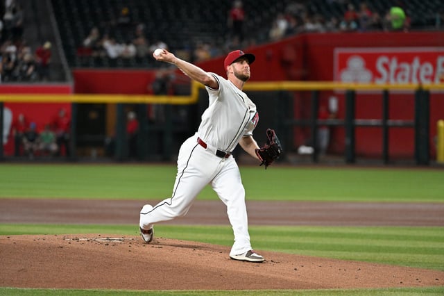 PHOENIX, ARIZONA - JULY 20: Merrill Kelly #29 of the Arizona Diamondbacks delivers a first inning pitch against the St. Louis Cardinals at Chase Field on July 20, 2025 in Phoenix, Arizona.