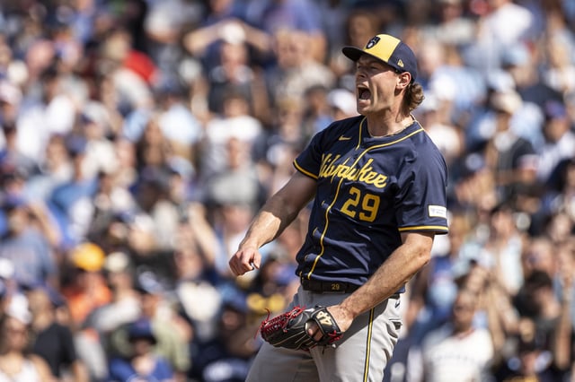 CHICAGO, ILLINOIS - JUNE 19: Trevor Megill #29 of the Milwaukee Brewers reacts after the final out of a game against the Chicago Cubs at Wrigley Field on June 19, 2025 in Chicago, Illinois.